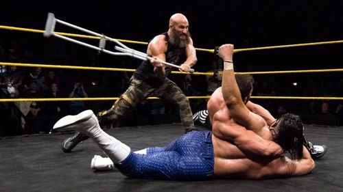 Ciampa attacks Gargano with the crutch