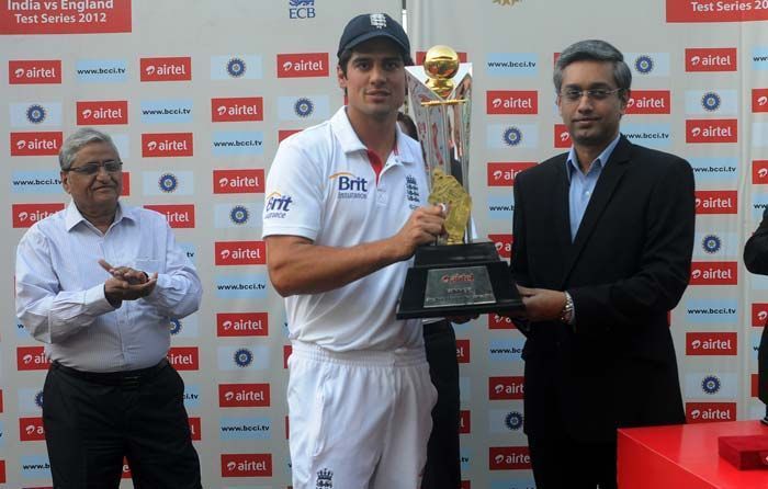 Alastair Cook collecting the winners trophy after defeating India in it's own backyard