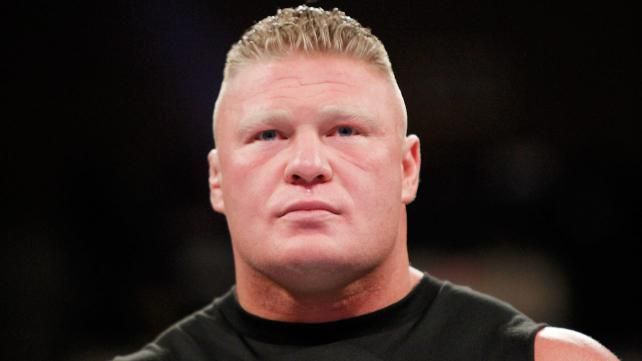 Brock Lesnar looks on