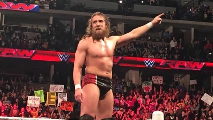 Daniel Bryan points up at WrestleMania sign
