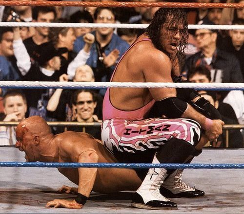 Stone Cold trapped in Bret Hart&#039;s Sharpshooter.