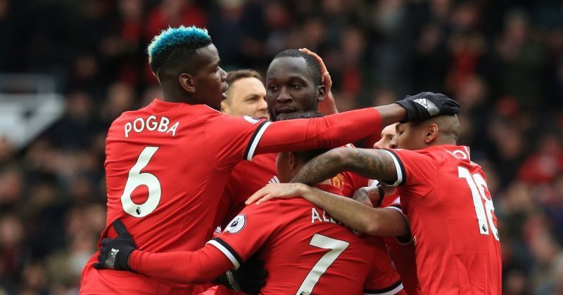 Manchester United players celebrating a goal against Swansea