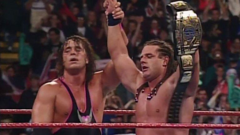 Bret Hart congratulates his brother-in-law after a legendary match.
