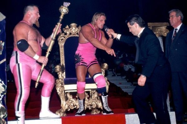 The King of Harts orders Todd Pettengill to kneel.