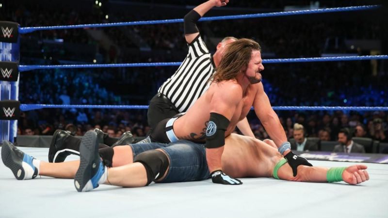 Styles and Cena at a SmackDown Live event.