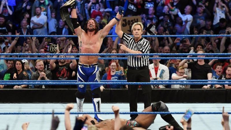 Charles Robinson congratulates AJ Styles live in the arena, and again about five hours later for American fans.