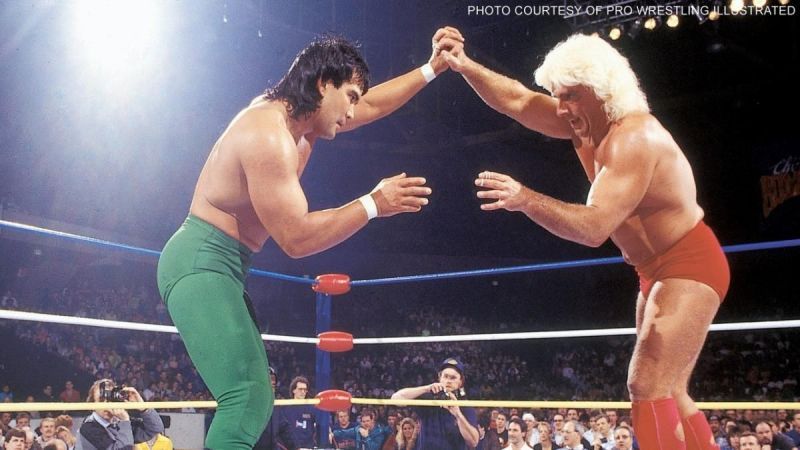 Ricky Steamboat (Green) locks up carefully with Ric Flair (Red.)