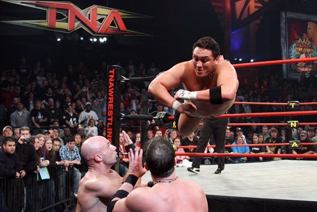 Samoa Joe dives onto AJ Styles and Christopher Daniels