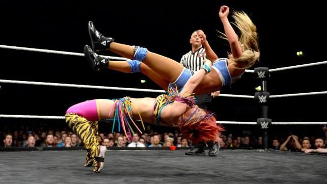 Asuka executes a german suplex on her hapless victim.