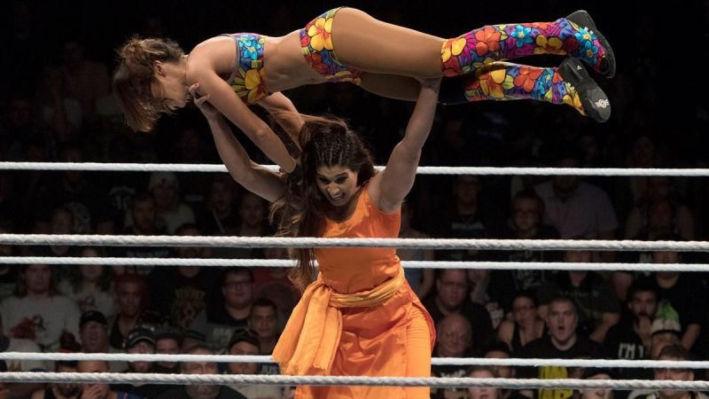 Kavita Devi lifting Dakota Kai above her head