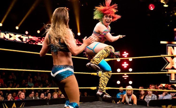 Asuka unleashes one of her trademark kicks.