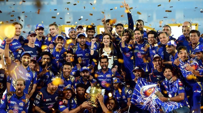 Mumbai Indians players and Owner Neeta Ambani with IPL 10 trophy after they win the IPL 10 Final match against Rising Pune Supergiants in Hyderabad on Sunday. (Photo: AP)