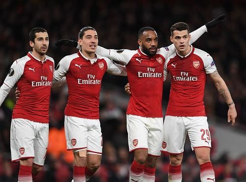 Lacazette celebrates with his teammates after scoring Arsenal's fourth goal of the night