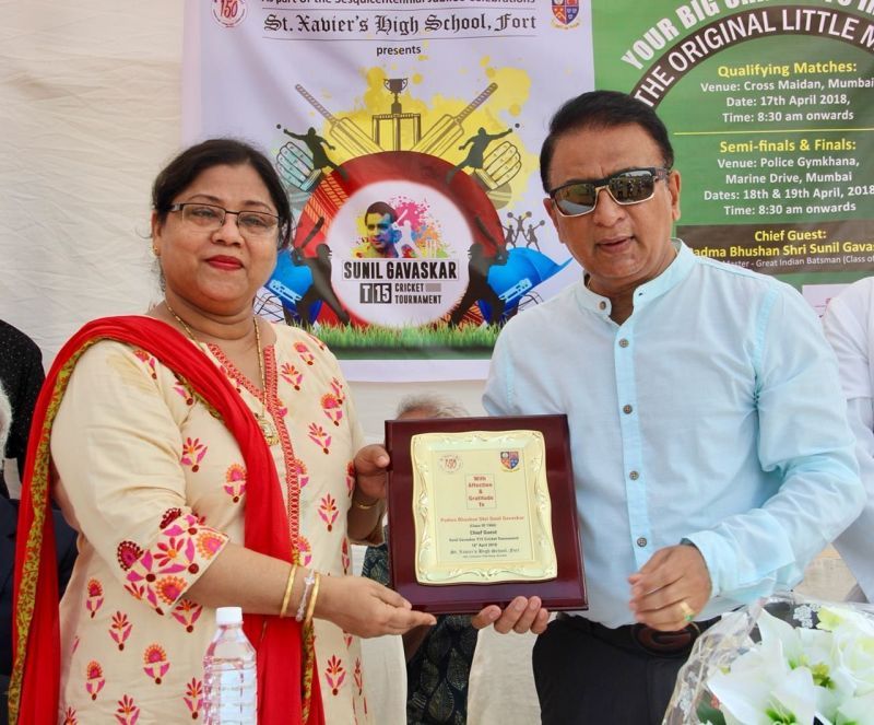 Mr. Gavaskar receiving a memento from Ms. Jennifer Dias. Principal of St. Xavier's High School, Fort 