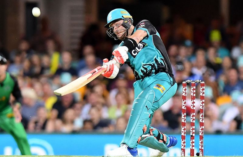 Brendon McCullum hoisting a six over extra cover playing for Brisbane Heat