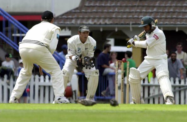 Adam Parore watches as Aminul Islam keeps a close