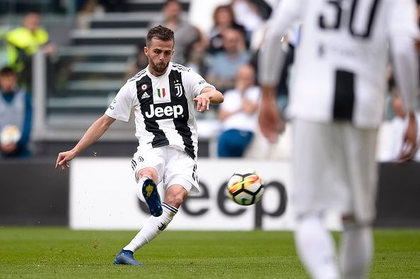 Miralem Pjanic (L) of Juventus FC scores a goal during the...