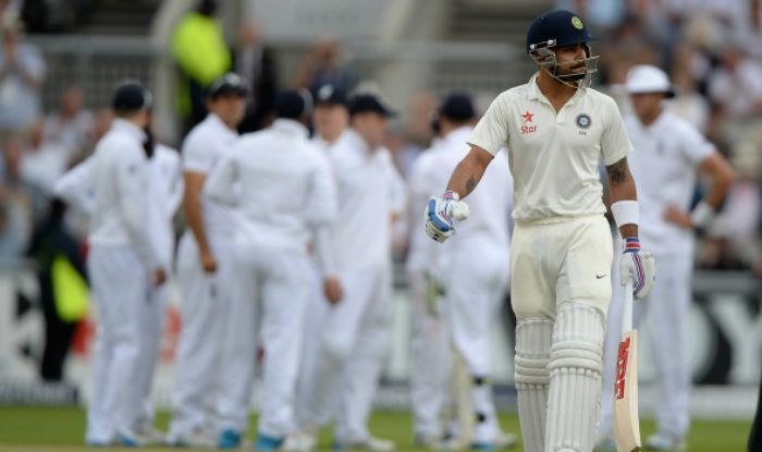 Kolhi walks off after being dismissed by James Anderson in 2014