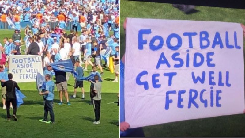 Two Manchester City fans held up banner paying tribute to their former rival manager 