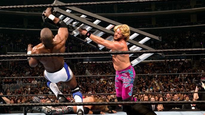 Chris Jericho smashes Shelton Benjamin with a ladder at Wrestlemania 21.