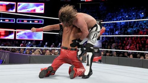 Shinsuke Nakamura low blows AJ Styles.