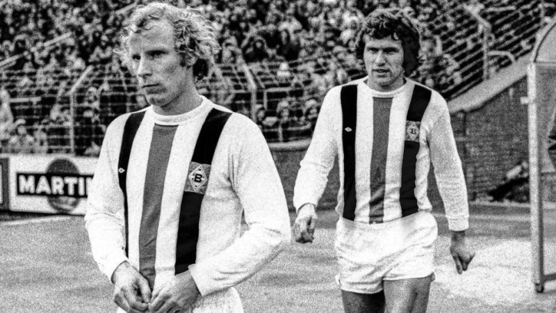 Jupp Heynckes (right) slots in as a Gladbach player alongside Berti Vogts (left); [Via: Bundesliga.com]