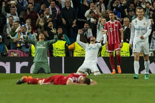 Real Madrid players celebrate their victory as Bayern Munich players are left distraught