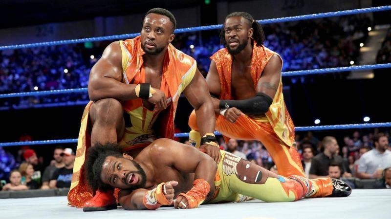 Xavier Woods and the New Day look on as Cesaro and Sheamus celebrate