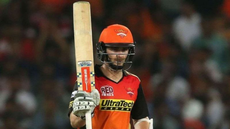 Kane Williamson holds the orange cup for leading run-scorer in IPL 2018