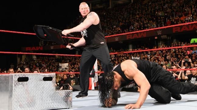 Image result for wwe brock lesnar beats roman on raw