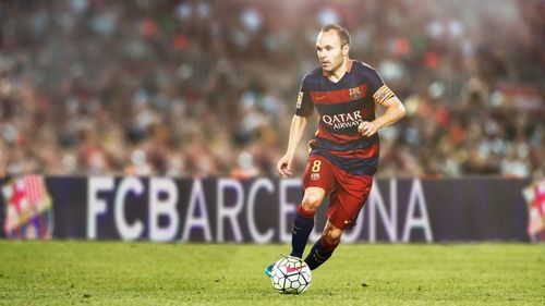 AndrÃ©s Iniesta is dyed in the blue and garnet colours of FC Barcelona