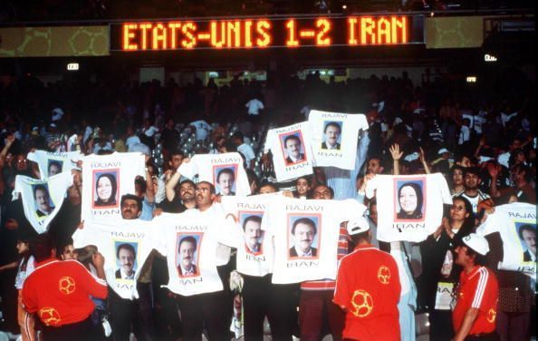 1998 World Cup Finals. Lyon, France. 21st JUNE 1998. USA 1 v Iran 2. Iranian fans celebrate after their team&#039;s win holding T-shirts displaying a political message.
