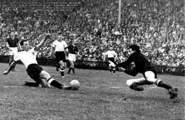 1954 World Cup Final. Bern,Switzerland. 4th July 1954. West Germany.3.v Hungary.2. West Germany&#039;s Max Morlock stretches to beat Hungary goalkeeper Gyula Grosics and score their first goal.