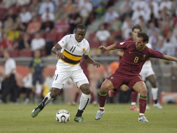 BT Sport. Football. FIFA World Cup. Cologne. 11th June 2006. Angola 0 v Portugal 1. Angola&#039;s Mateus, left, challenged by Portugal&#039;s Petit.