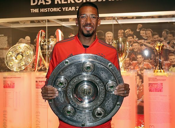 Jerome Boateng Hands Over German Championship Trophy To FCB Erlebniswelt