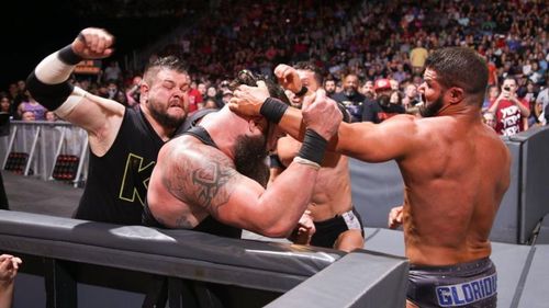 Image result for wwe kevin owens frog splash from ladder to strowman