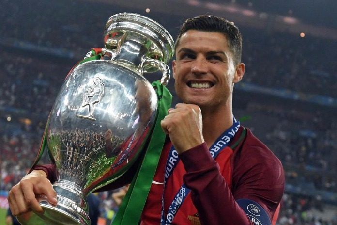 Cristiano Ronaldo posing with the 2016 Euros trophy