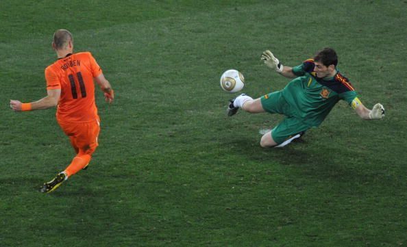 Spain&#039;s goalkeeper Iker Casillas (R) pul