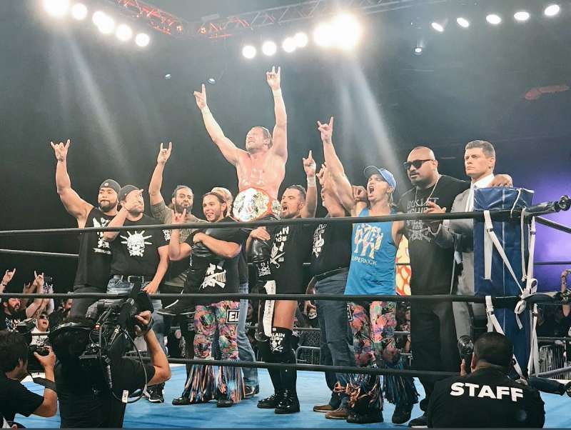 Omega celebrating his US Title win with the entire Bullet Club 