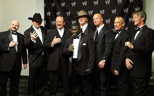 From left to right: Howard Finkel, Dory Funk Jr., Terry Funk, Koko B.Ware, 'Cowboy' Bill Watts, Steve Austin, Ricky Steamboat and Kevin Von Erich