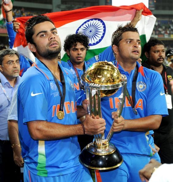 Indian players Virat Kohli (L) and Sures