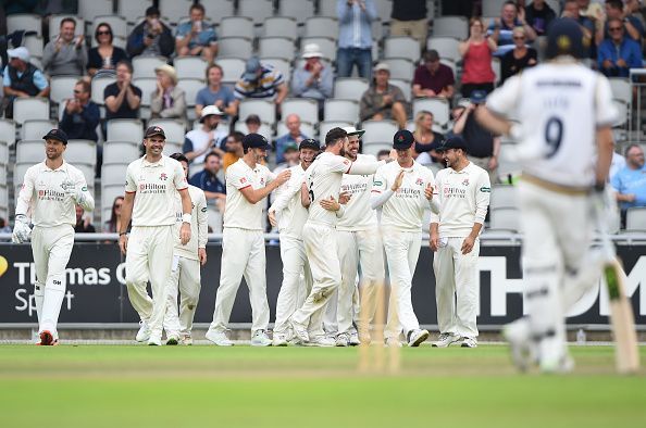 Clark is surrounded by his teammates after picking up the hat-trick