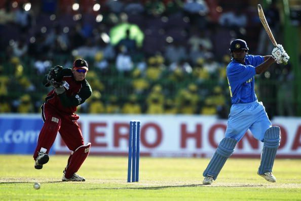 Mohammad Kaif of India on his way to a century watched by Andy Flower of Zimbabwe