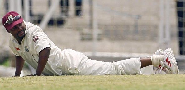 West Indian captain Brian Lara gets up f