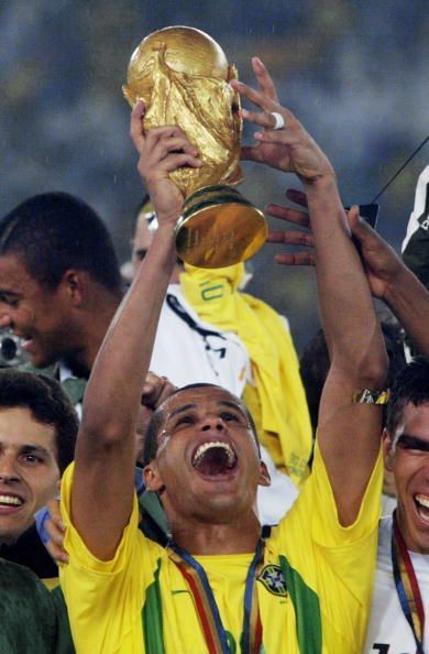 Brazil's midfielder Rivaldo hoists the World Cup t