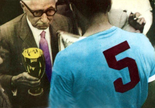 Sport. Football. World Cup Final. 16th July 1950. Maracana Stadium, Rio de Janeiro. Brazil 1. v Uruguay 2. Obdulio Varela, the Uruguay World Cup winning captain of 1950, receives the trophy from Jules Rimet. Uruguay upset predictions of an easy victory fo