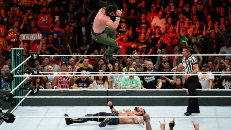 Elias with a diving elbow on Seth Rollins