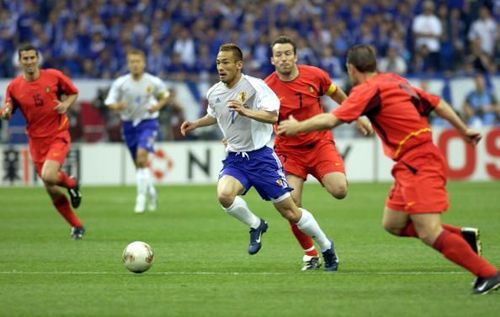 BT Football. 2002 FIFA World Cup Finals. Saitama, Japan. 4th June 2002. Japan 2 v Belgium 2. Japan's Hidetoshi Nakata passes the challenge of Belgium's Marc Wilmots.