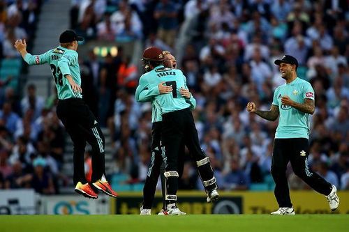 Surrey players in delight at the end of their first win