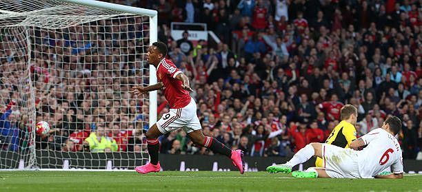 Martial celebrating after scoring on his debut in front of the Stretford end